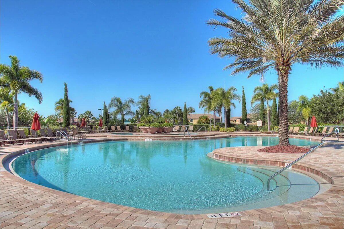 Resort clubhouse pool with palm trees